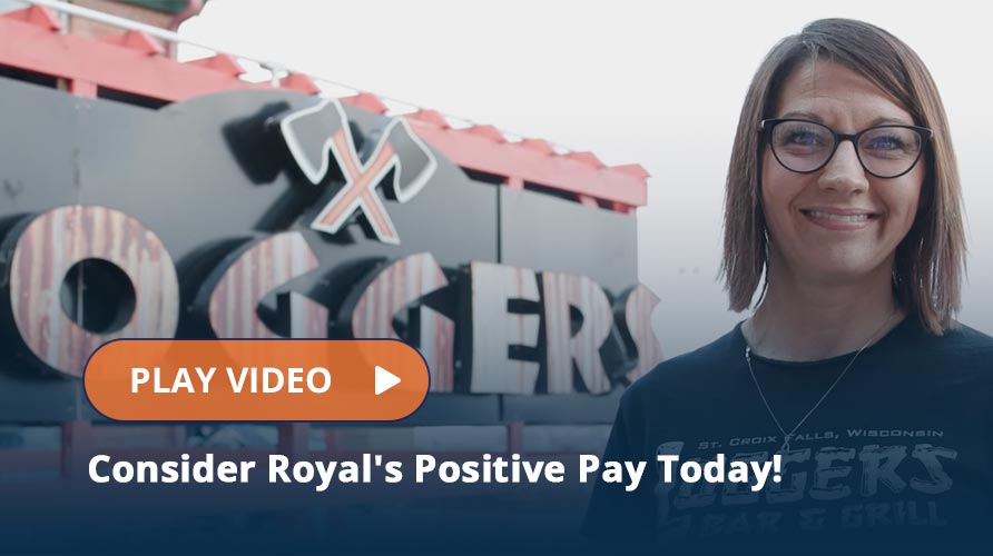 Loggers Business Member standing in front of sign