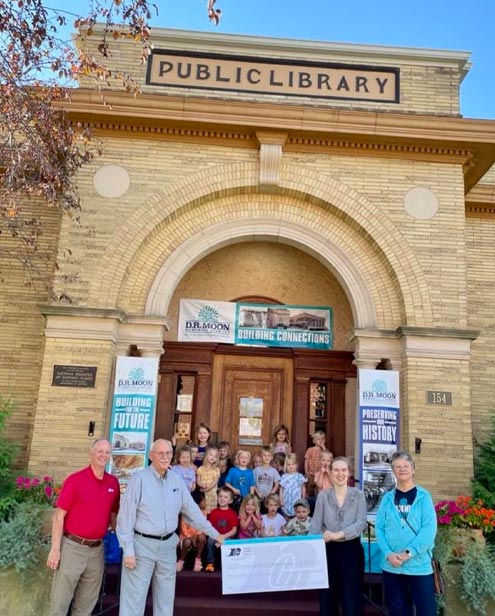 Photo of leaders in front of the library