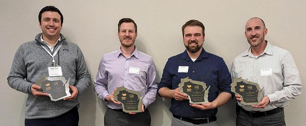 Royal Credit Union team members holding the award