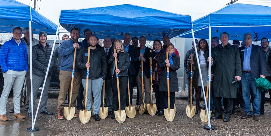 Team of Royal Credit Union folks with shovels