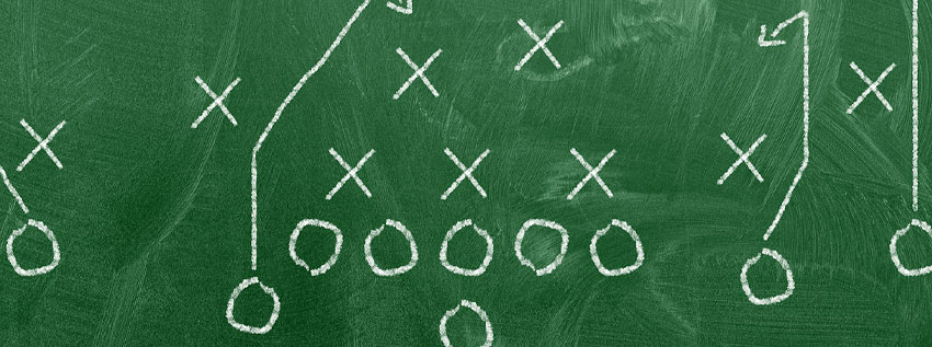 Sketch of football plays on chalkboard