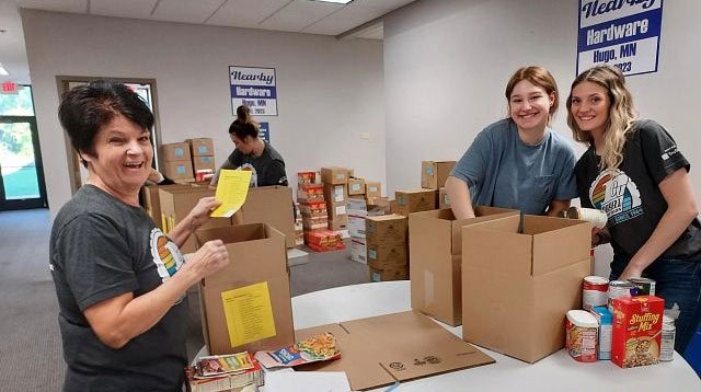 Group of volunteers working at food shelf