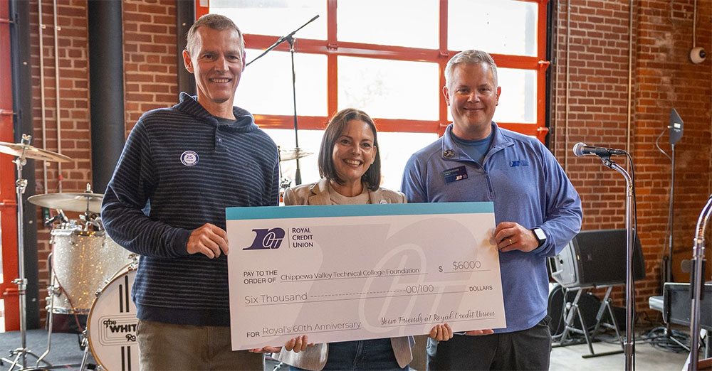 Group of leaders holding up a big check for $6,000