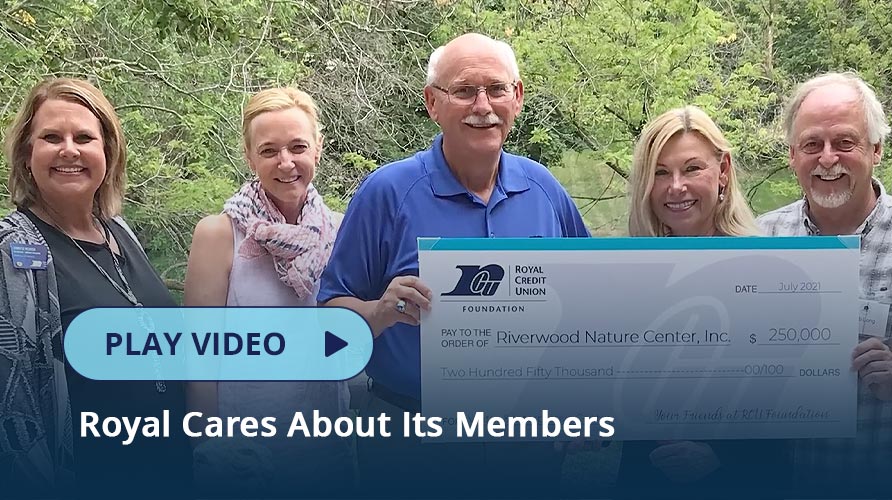 Photo of RCU board holding a check with a Foundation recipient