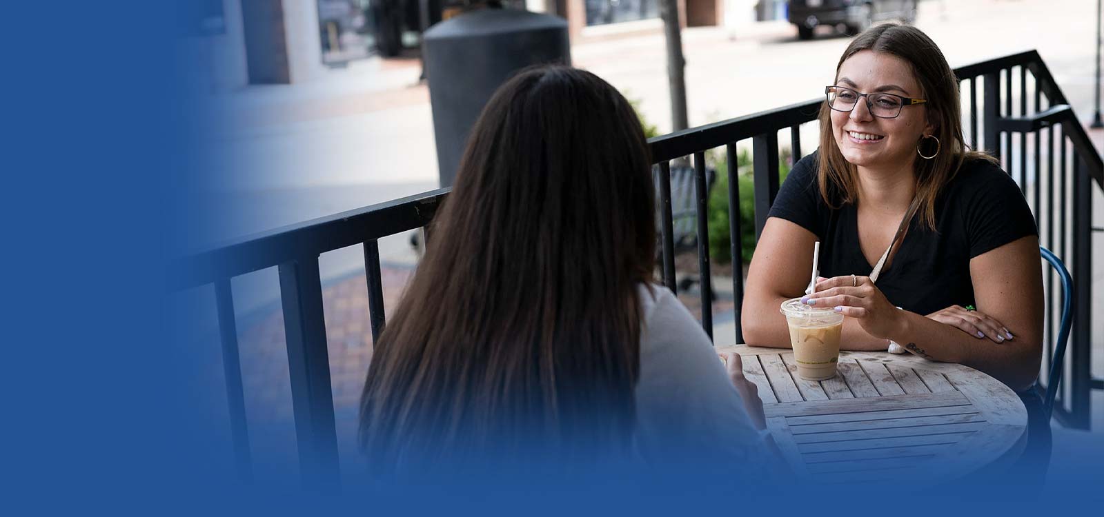 Young gals sitting at coffee shop