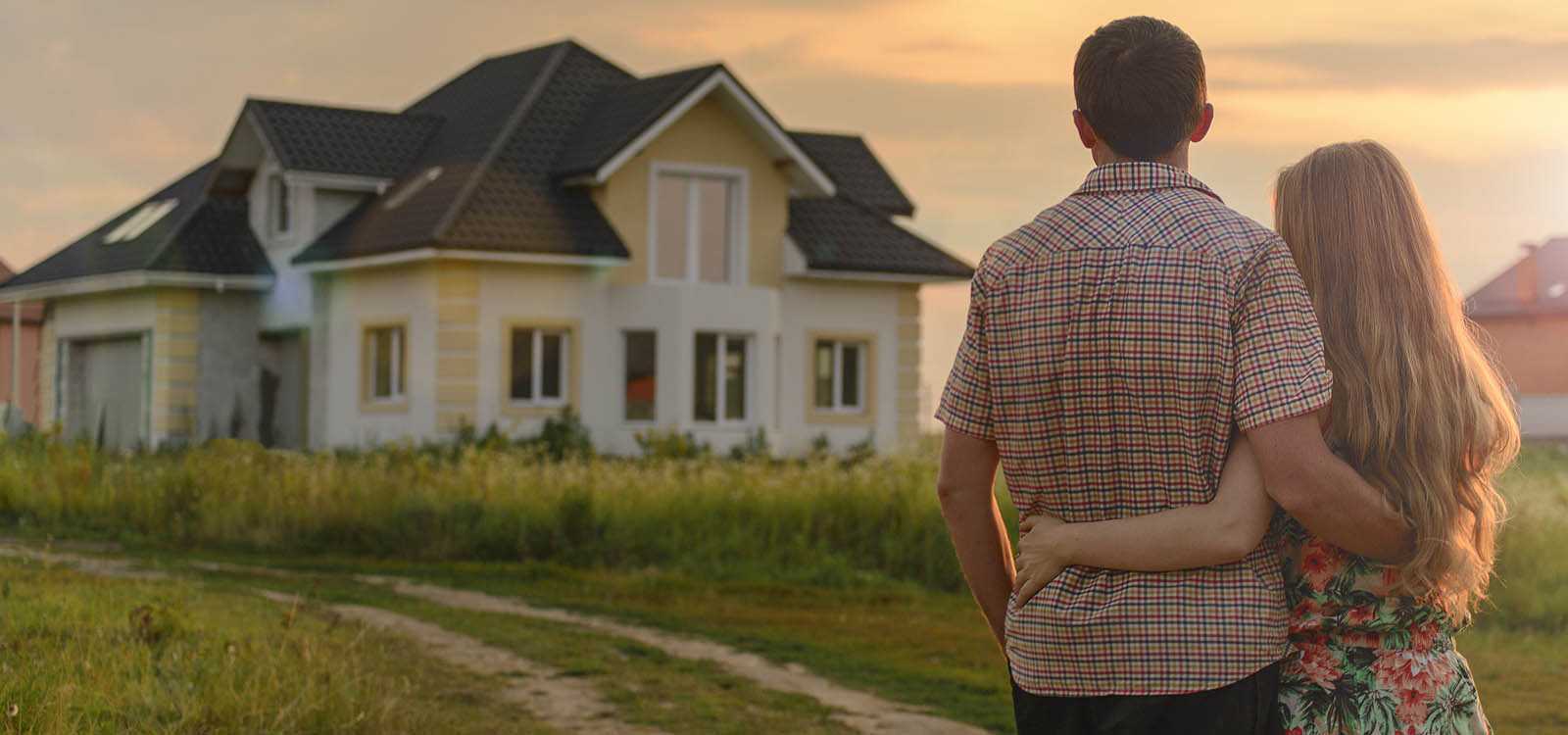 A younger couple looking at their new home