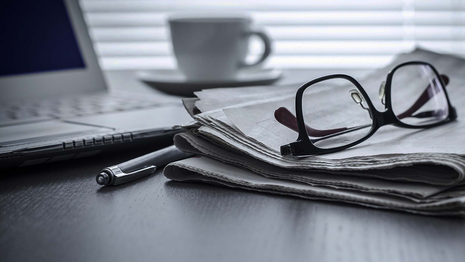 Glasses and newspaper