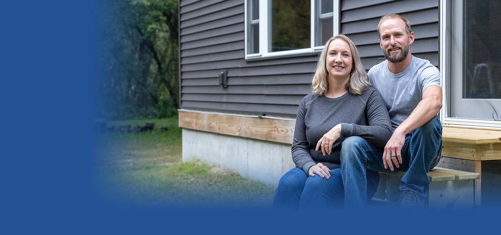 Husband and wife sitting on front porch