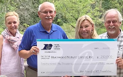 Photo of RCU board holding a check with a Foundation recipient