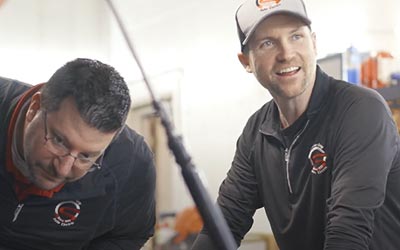 Business Member working in his shop with his partner